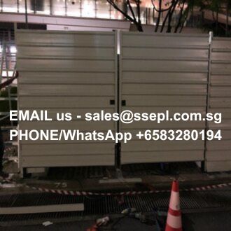Nighttime scene of metal construction barriers with a bright orange cone in front; overlay text reads: 'EMAIL us - sales@ssepl.com.sg PHONE/WhatsApp +6583280194'
