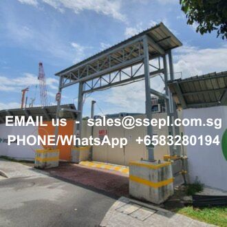 Industrial entrance with a steel gantry over a driveway; white overlay text shows contact info: 'EMAIL us', 'sales@ssepl.com.sg', 'PHONE/WhatsApp +6583280194'.